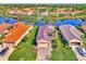 Community of homes near a lake, with lush green landscaping at 3179 Osprey Ln, Port Charlotte, FL 33953