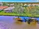 Aerial view of a home with a backyard and canal access at 3179 Osprey Ln, Port Charlotte, FL 33953