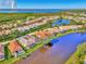 Community overview featuring canal front homes and lush landscape at 3179 Osprey Ln, Port Charlotte, FL 33953