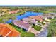 Aerial view of waterfront homes with tile roofs at 3179 Osprey Ln, Port Charlotte, FL 33953