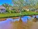 Aerial view of a home with backyard and canal views at 3179 Osprey Ln, Port Charlotte, FL 33953