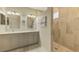 Bathroom with double vanity, quartz countertops, and large walk-in shower at 3179 Osprey Ln, Port Charlotte, FL 33953
