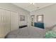 Bright bedroom with double doors and en-suite bathroom at 3179 Osprey Ln, Port Charlotte, FL 33953