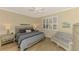 Spacious bedroom with king-size bed and sitting area at 3179 Osprey Ln, Port Charlotte, FL 33953
