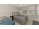 Cozy bedroom with a comfortable bed and view at 3179 Osprey Ln, Port Charlotte, FL 33953