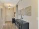 Bright entryway with dark console table and decorative wall art at 3179 Osprey Ln, Port Charlotte, FL 33953