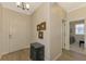 Light and airy entryway with dark wood console table and mirrors at 3179 Osprey Ln, Port Charlotte, FL 33953
