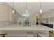 Modern kitchen with white cabinets and quartz countertops at 3179 Osprey Ln, Port Charlotte, FL 33953