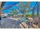 Screened lanai with spa and outdoor seating at 3179 Osprey Ln, Port Charlotte, FL 33953