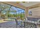 Relaxing lanai with seating area and spa views at 3179 Osprey Ln, Port Charlotte, FL 33953