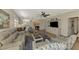 Spacious living room with comfortable seating and large TV at 3179 Osprey Ln, Port Charlotte, FL 33953