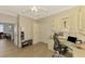 Bright office with built-in desk and view of kitchen at 3179 Osprey Ln, Port Charlotte, FL 33953