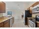 Stainless steel appliances and granite countertops in this kitchen at 4375 Kempson Ln, Port Charlotte, FL 33981