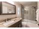 Bathroom with granite countertop, single vanity, and tub shower combo at 4442 Windsong Ave, North Port, FL 34287