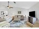 Relaxing living room with neutral tones and ample natural light at 611 Chestnut Ln, Englewood, FL 34223