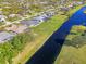 Aerial view showcasing a canal and neighboring houses at 634 Boundary Blvd, Rotonda West, FL 33947