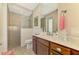 Clean bathroom with walk-in shower, large vanity, and updated fixtures at 634 Boundary Blvd, Rotonda West, FL 33947