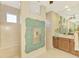 Spa-like bathroom with a large walk-in shower and dual vanities at 634 Boundary Blvd, Rotonda West, FL 33947