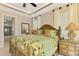 King-size bedroom with ensuite bathroom and tropical bedding at 634 Boundary Blvd, Rotonda West, FL 33947