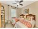 Guest bedroom with twin beds, coastal decor and built-in shelving at 634 Boundary Blvd, Rotonda West, FL 33947