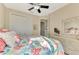 Bedroom with queen bed, coastal decor, and access to the bathroom at 634 Boundary Blvd, Rotonda West, FL 33947