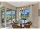 Breakfast nook with glass-top table and pool view at 634 Boundary Blvd, Rotonda West, FL 33947