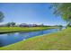 View of a tranquil canal with lush green landscape at 634 Boundary Blvd, Rotonda West, FL 33947