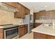 Modern kitchen with stainless steel appliances and granite countertops at 634 Boundary Blvd, Rotonda West, FL 33947