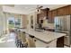 Eat-in kitchen with island seating and stainless steel appliances at 634 Boundary Blvd, Rotonda West, FL 33947