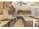 Well-equipped kitchen featuring stainless steel appliances and custom cabinetry at 634 Boundary Blvd, Rotonda West, FL 33947