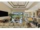 Open living space showcasing a view of the pool and kitchen at 634 Boundary Blvd, Rotonda West, FL 33947