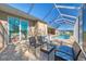 Enjoy the view from this relaxing patio with pool access at 634 Boundary Blvd, Rotonda West, FL 33947