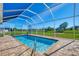 Enjoy this refreshing, screened-in pool at 634 Boundary Blvd, Rotonda West, FL 33947