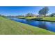 Peaceful waterfront view with a dock and green lawn at 634 Boundary Blvd, Rotonda West, FL 33947
