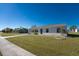 Single story home with a landscaped yard and sidewalk at 6379 Coliseum Blvd, Port Charlotte, FL 33981