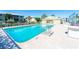 Inviting community pool with ample deck space for lounging at 6600 Gasparilla Pines Blvd # 204, Englewood, FL 34224