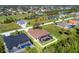 Bird's-eye view of the house, showcasing neighborhood and pool at 76 Long Meadow Ct, Rotonda West, FL 33947