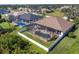 Property features a large backyard, pool, and screened enclosure at 76 Long Meadow Ct, Rotonda West, FL 33947