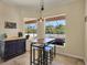 Charming breakfast nook with a view of the pool and backyard at 76 Long Meadow Ct, Rotonda West, FL 33947