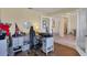 Bright home office with built-in desk and view into the dining area at 76 Long Meadow Ct, Rotonda West, FL 33947