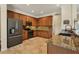 Well-equipped kitchen with stainless steel appliances, granite countertops, and ample cabinetry for storage and meal prep at 76 Long Meadow Ct, Rotonda West, FL 33947