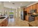 Bright kitchen with granite countertops, stainless steel appliances, and breakfast nook at 76 Long Meadow Ct, Rotonda West, FL 33947