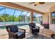 Relaxing screened lanai overlooking the pool and backyard at 76 Long Meadow Ct, Rotonda West, FL 33947