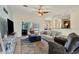 Spacious living area with comfy furniture and a large TV at 76 Long Meadow Ct, Rotonda West, FL 33947