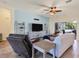 Relaxing living room featuring a neutral color palette and a view of the pool at 76 Long Meadow Ct, Rotonda West, FL 33947