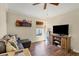 Comfortable living room with sectional sofa and large TV at 76 Long Meadow Ct, Rotonda West, FL 33947