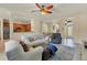 Bright living room with hardwood floors, neutral walls, and comfortable seating at 76 Long Meadow Ct, Rotonda West, FL 33947