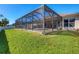 Screened-in pool and patio area at 76 Long Meadow Ct, Rotonda West, FL 33947