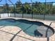 Inviting in-ground pool with brick paver surround and screened enclosure provides a private backyard oasis at 76 Long Meadow Ct, Rotonda West, FL 33947
