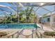 Relax by the pool, screened enclosure offers shade and privacy at 845 Texas St, Englewood, FL 34223